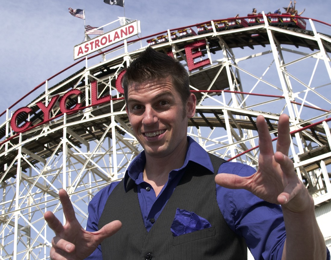 Magic Brian posing in front of the Coney Island Cyclone